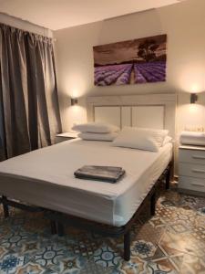 Postel nebo postele na pokoji v ubytování Hostal el Ciervo