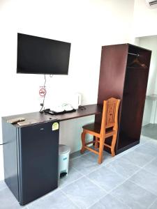 a desk with a computer and a chair in a room at Naranta House in Ko Raeng +15 photos