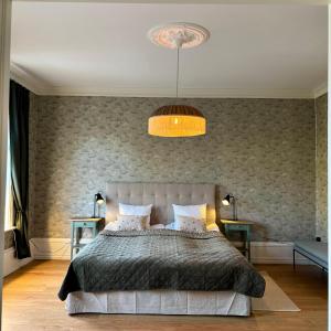 Ένα ή περισσότερα κρεβάτια σε δωμάτιο στο Stad & Hav, Lägenhet i Strömstads Hjärta