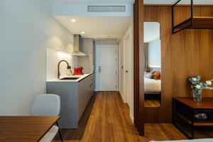 Kuchyň nebo kuchyňský kout v ubytování Apartamentos 2H LIVING