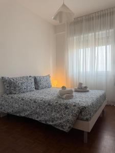 En eller flere senge i et værelse på Re Home Riccione