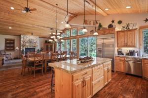 an open kitchen and dining room with a dining table at 5 Vine Maple in Sunriver