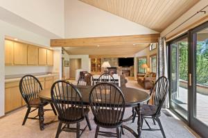 a kitchen and dining room with a table and chairs at 10 Tan Oak in Sunriver