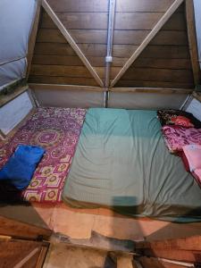 Ένα ή περισσότερα κρεβάτια σε δωμάτιο στο Beyond Brahmaputra & Eagles Nest