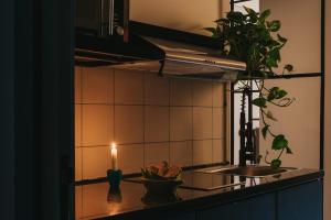 a kitchen with a lit candle on a counter at Brassbell l DT l Hannaux l Tahrir sq in Cairo +123 photos