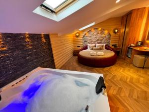 a room with a bed and a bath tub at Gumus Palace Hotel in Istanbul +58 photos