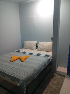 Giường trong phòng chung tại Pu Ya Deep Forest Homestay