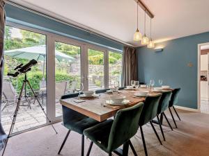 a dining room with a table and chairs and a camera at 5 Bed in Wareham oc-83036 in West Lulworth +15 photos