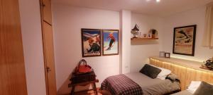 En eller flere senge i et værelse på Precioso apartamento Montblanc