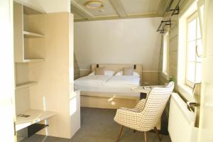 Un pat sau paturi într-o cameră la Prezidentská