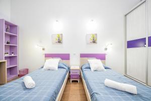 En eller flere senge i et værelse på Canary Holiday Mondragon House + 25 billeder