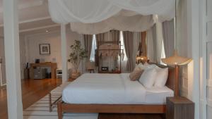 Ένα ή περισσότερα κρεβάτια σε δωμάτιο στο Busaba Ayutthaya Hotel