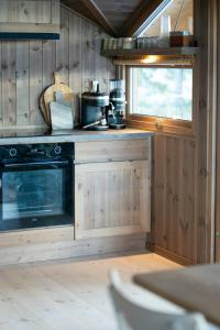 Η κουζίνα ή μικρή κουζίνα στο Design Cabin With Panoramic Views Near Sjusjøen