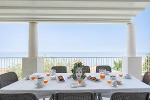 a white table with a mask on top of it at Villa Stellata in Naso