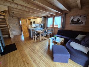 a living room with a couch and a table at Triberga Verwall in Sankt Gallenkirch