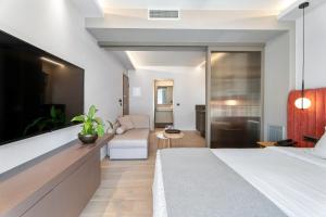 Postel nebo postele na pokoji v ubytování Ennea Muses Rooms and Suites