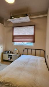 Ένα ή περισσότερα κρεβάτια σε δωμάτιο στο 협재10분 영주스테이