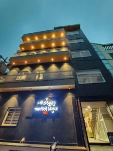 a building with a sign on the side of it at Shree Hari Das Chamkili Nikunj in Vrindāvan