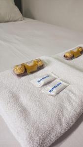 Ένα ή περισσότερα κρεβάτια σε δωμάτιο στο Sao Luis Praia Studio +7 φωτογραφίες