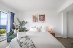 Ένα ή περισσότερα κρεβάτια σε δωμάτιο στο Harbourside Studio in Pyrmont with Pool, Gym, Sauna, & Parking spot +24 φωτογραφίες