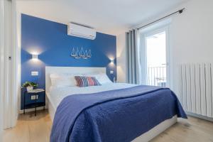 Ένα ή περισσότερα κρεβάτια σε δωμάτιο στο Bellano Holidays - Casa Artemio