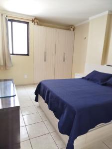 En eller flere senge i et værelse på Flat beira mar de Tambaú