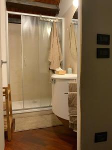 a bathroom with a shower and a toilet and a sink at Ca' Molinetto in Treviso