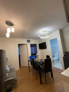 a living room with a dining room table and chairs at San Remo Oasis at City Di Mare in Cebu City