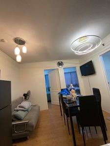 a living room with a table and a couch at San Remo Oasis at City Di Mare in Cebu City