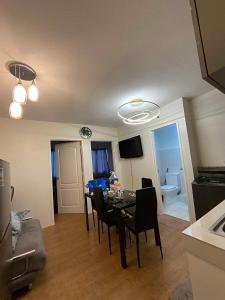 a dining room with a table and chairs in a room at San Remo Oasis at City Di Mare in Cebu City