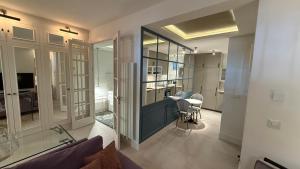 a living room with a couch and a table at Stylish Haven in Chic Salamanca in Madrid