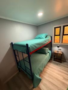 Ένα ή περισσότερα κρεβάτια σε δωμάτιο στο Cabañas Bello Atardecer