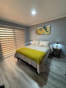 Ένα ή περισσότερα κρεβάτια σε δωμάτιο στο Cabañas Bello Atardecer