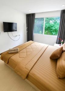 Ένα ή περισσότερα κρεβάτια σε δωμάτιο στο Relaxing Apartment in Karon +12 φωτογραφίες