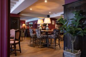 a dining room with a table and chairs at The George and Dragon - A Heartwood Inn in Marlow