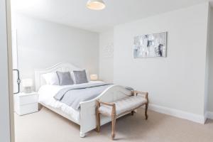 En eller flere senge i et værelse på 32 Evesham Road