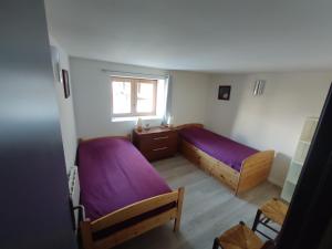 En eller flere senge i et værelse på Maison de village 4 à 6 personnes