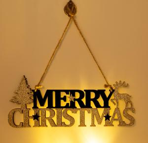 Un cartel con las palabras Feliz Navidad colgado en Home-Like Studio Walking Distance to the Old Town l Washing Machine l Bus Station Nearby, en Novi Sad 31 fotos más