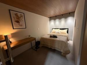 Ένα ή περισσότερα κρεβάτια σε δωμάτιο στο Loft Premium Andradina