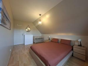 Ένα ή περισσότερα κρεβάτια σε δωμάτιο στο Le Clos des Embruns