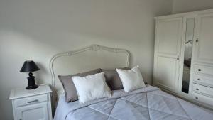 En eller flere senge i et værelse på Verto Departamentos