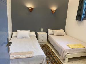 Postel nebo postele na pokoji v ubytování Peace & Freedom Guesthouse - West Bank