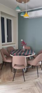 a dining room with a table and chairs at La Casa di Paddington in Piana di Caiazzo