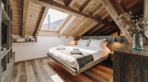 Un pat sau paturi într-o cameră la Valden Residence