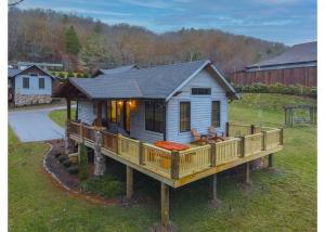 a tiny house on a deck in a yard at Banner Sky in Banner Elk