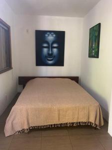 En eller flere senge i et værelse på Jasmim Manga