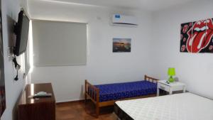 Ένα ή περισσότερα κρεβάτια σε δωμάτιο στο Las Margaritas 1042