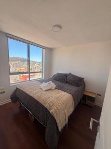 Ένα ή περισσότερα κρεβάτια σε δωμάτιο στο Vista Panorámica gran Concepción