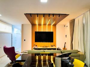 Et tv og/eller underholdning på Luxo Apartamento Marista Sul - Aparecida de Goiânia