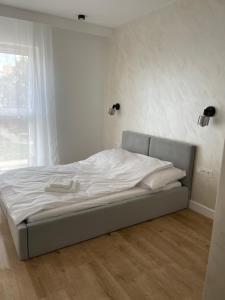 Ένα ή περισσότερα κρεβάτια σε δωμάτιο στο MG Rentals